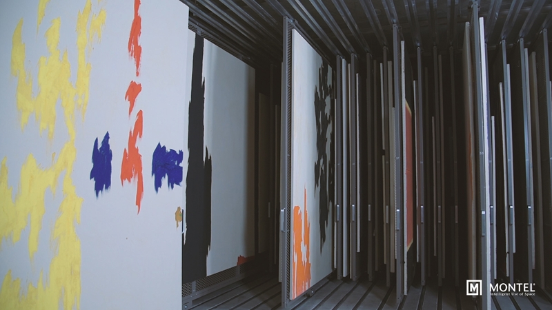 Hang student paintings on double-sided mobile art racks.